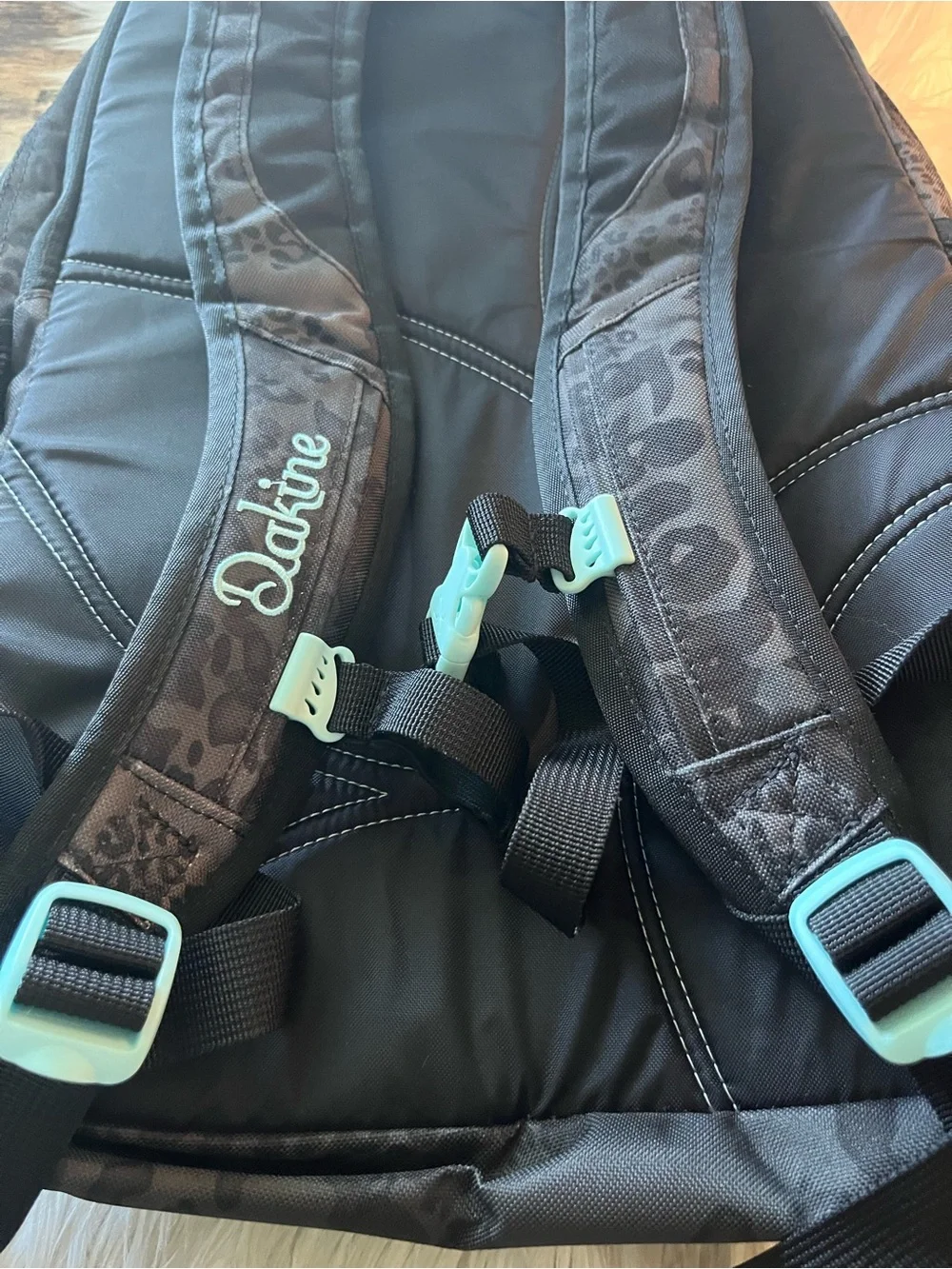 Dakine Black Leopard-Print Backpack with Teal Zipper Accents
